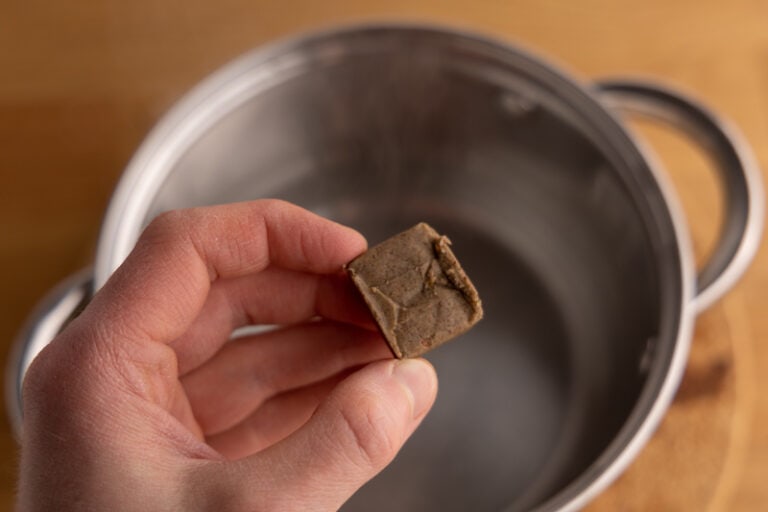 Adding a bouillon cube to water