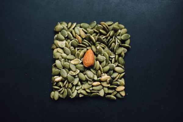 Almond on top of pumpkin seeds