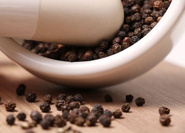 Ground pepper on mortar and pestle