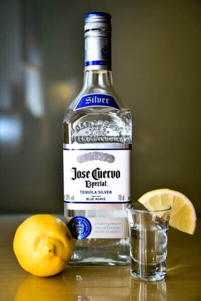 Botte of tequila with lemon