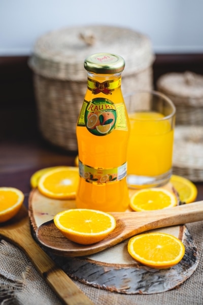 Bottle of orange juice and slices of orange