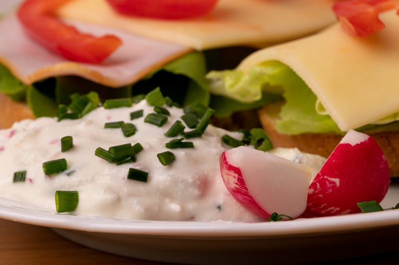 Bread and cream cheese with radishes