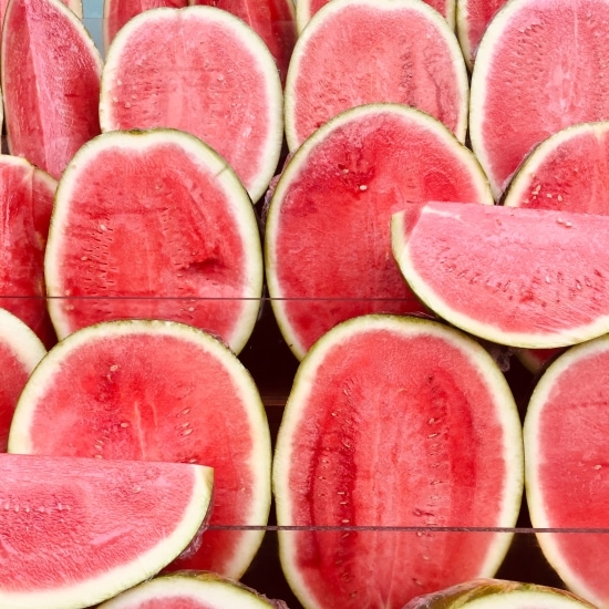 Bunch of halved and quatered watermelons