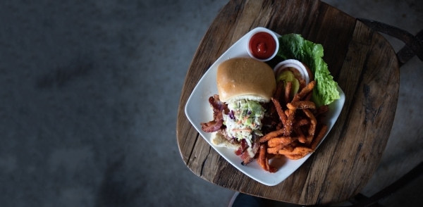 Burger, coleslaw, and sweet potato fries