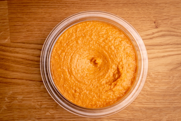 Chili-flavored hummus in a container