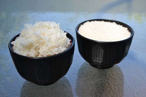 A cup of cooked and a cup of uncooked rice