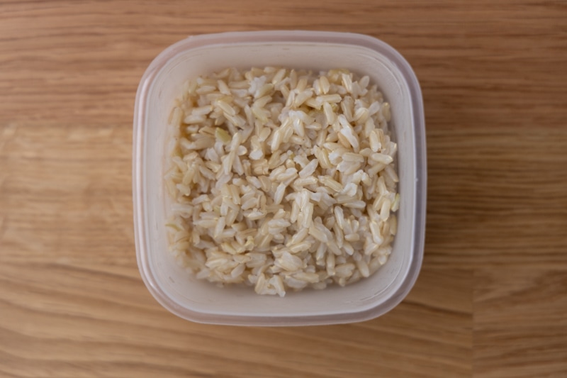 Cooked brown rice in a container