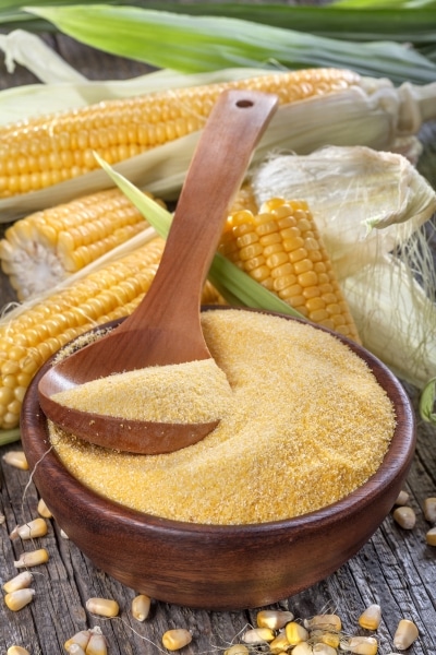 Corn grits in a wooden bowl