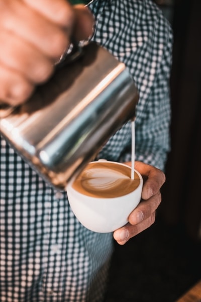 Creamer going into coffee