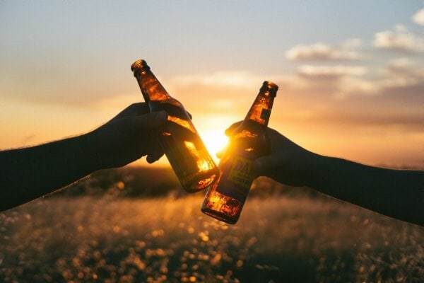 Drinking beer during sunset