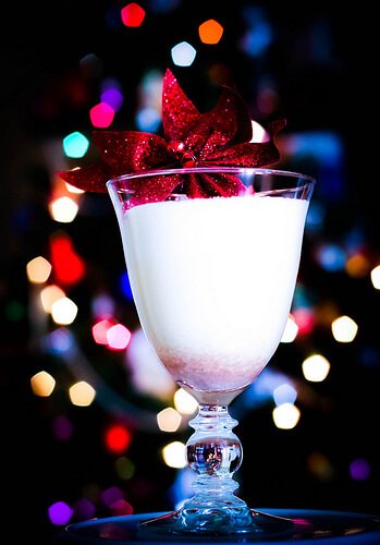 Eggnog in a glass with a ribbon