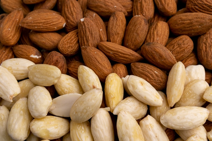 Equal parts unpeeled and peeled almonds