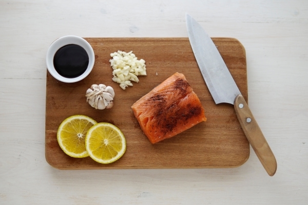 Fish, soy sauce, garlic, and lemon slices