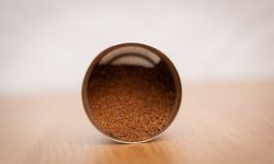 Freshly ground coffee in a grinder