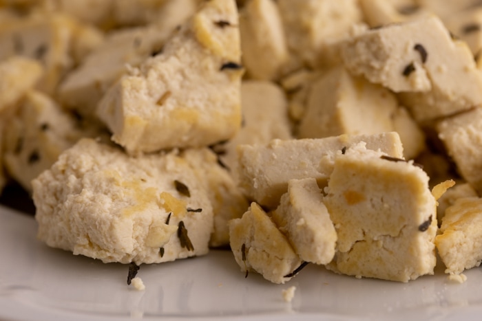 Fried tofu with spices closeup