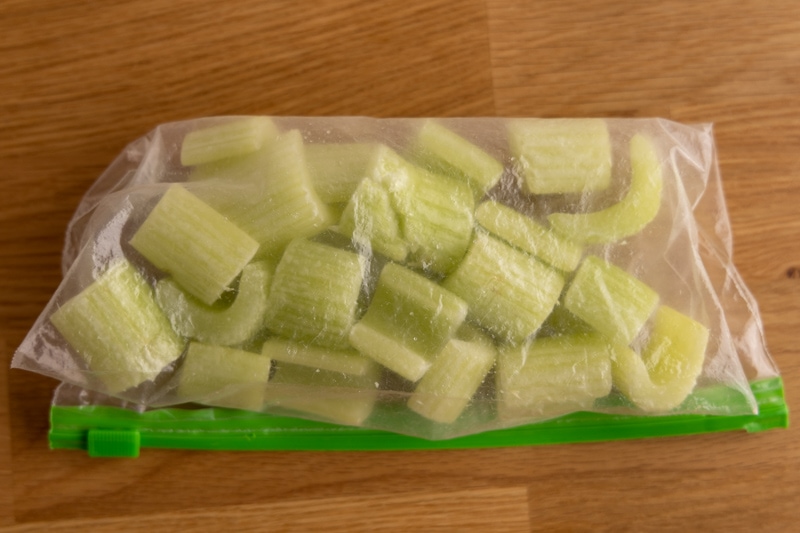 Frozen celery transferred to a freezer bag