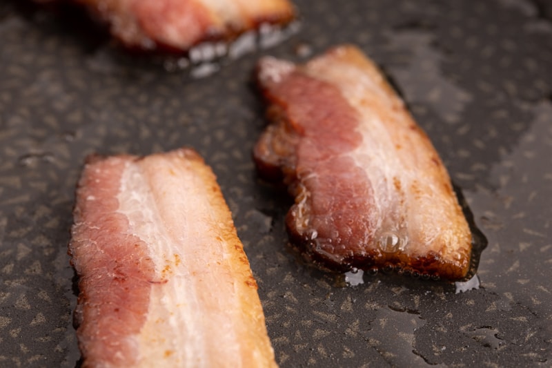 Frying bacon in its own fat