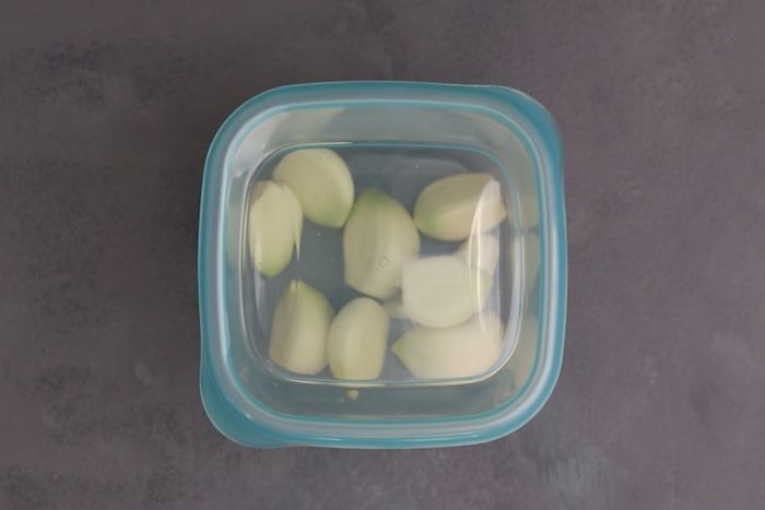 Garlic cloves in container ready for freezing