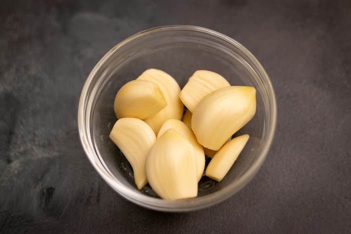 Garlic cloves in a glass bowl