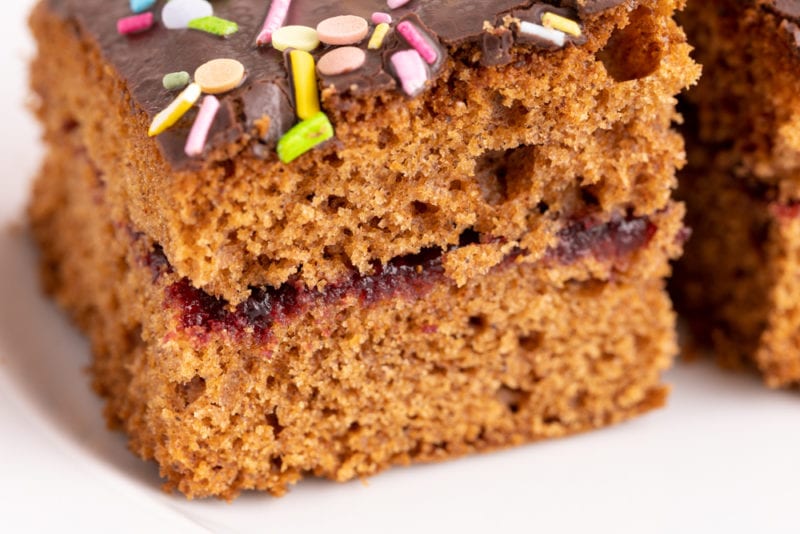 Gingerbread cake with jam and sprinkles