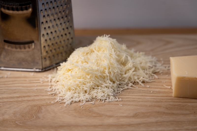 Grated parmesan on a cutting-board