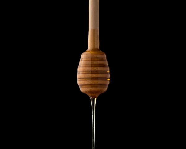 Honey dipper with honey dripping