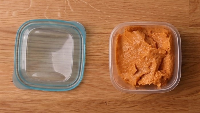 Hummus in a freezer container