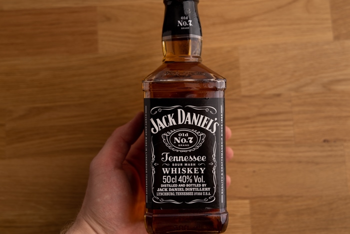 Jack Daniel's whiskey in hand