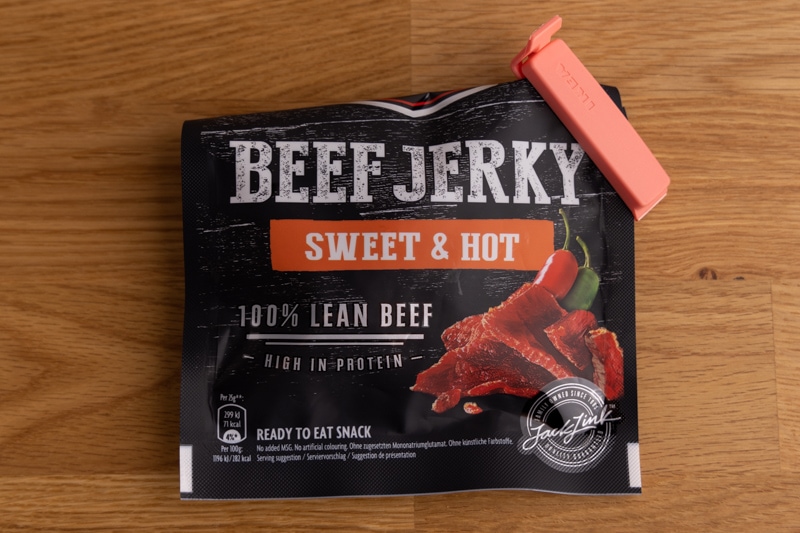 Jerky package sealed with a clip