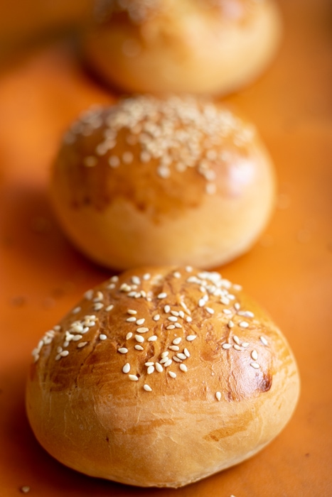 Line of baked bread rolls