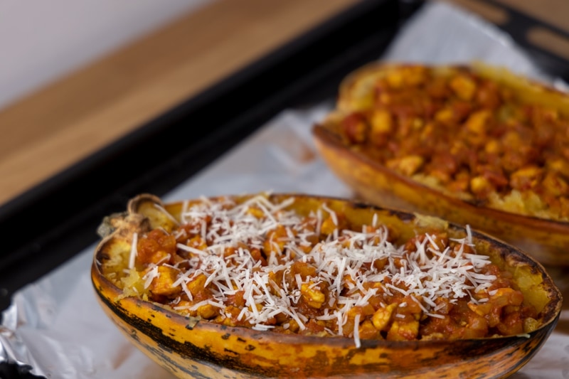 Melting cheese on spaghetti squash with chicken