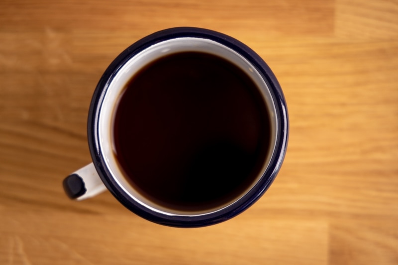 Metal mug with coffee