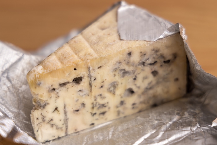 Old blue cheese: drying top and discolored mold