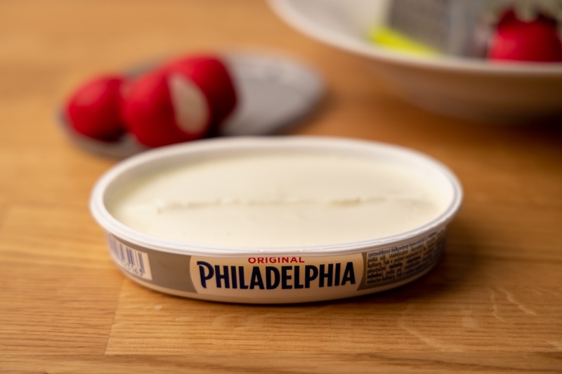 Opened cream cheese container