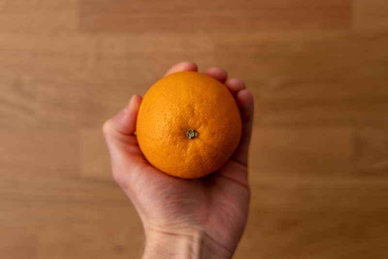 Orange in hand