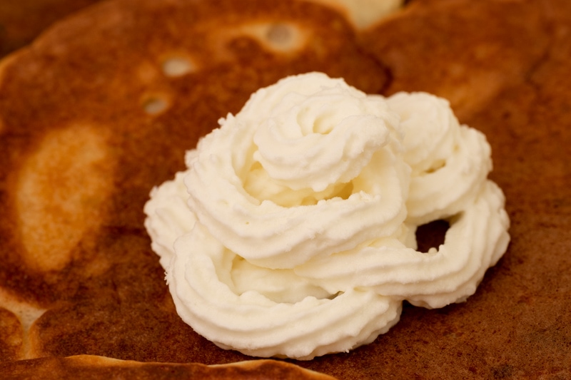 Pancake topped with whipped cream