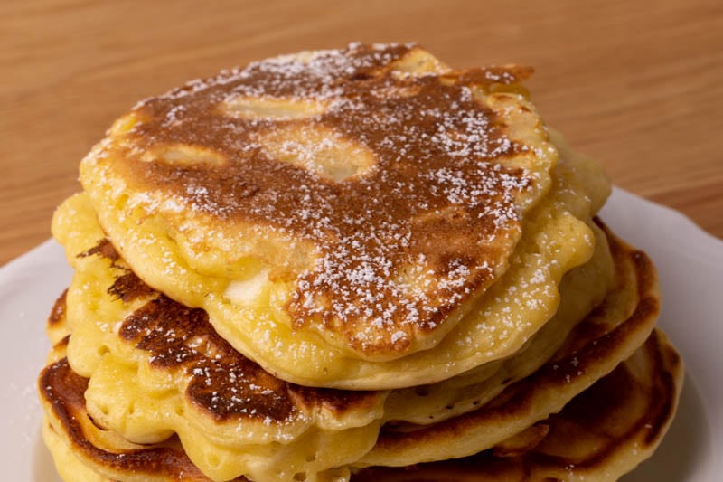 Pancakes topped with powdered sugar