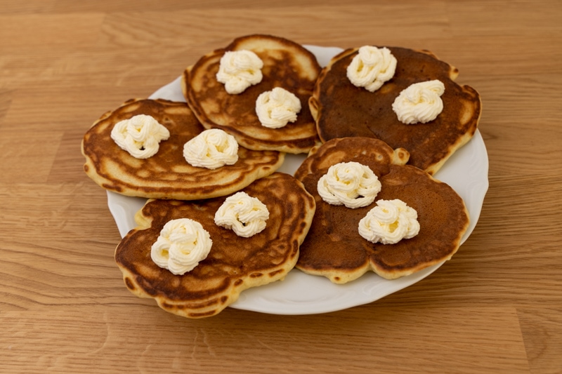 Pancakes topped with thawed whipped cream