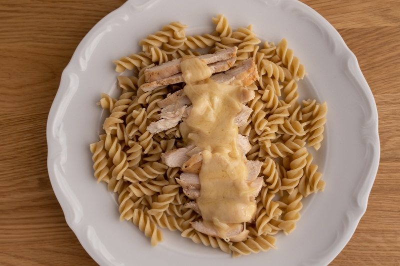 Pasta and chicken topped with alfredo