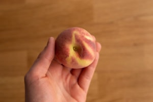Peach in hand
