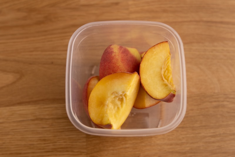 Peach slices in an airtight container