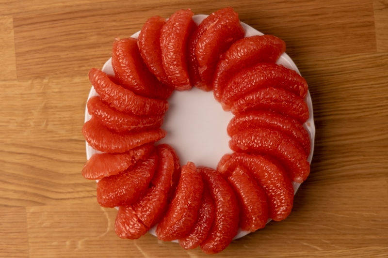 Peeled grapefruit in circle