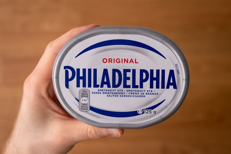 Philadelphia cream cheese in hand
