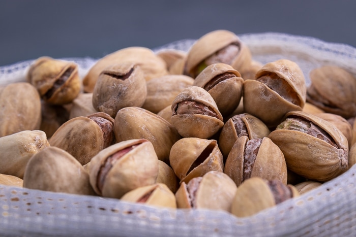 Pistachios in a mesh bag closeup