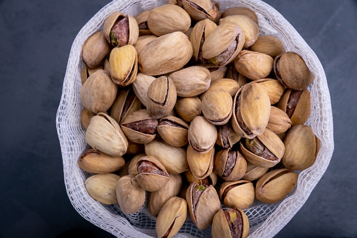 Pistachios in a mesh bag top down