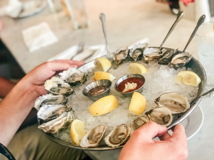 Plate of fresh oysters and cocktail sauce