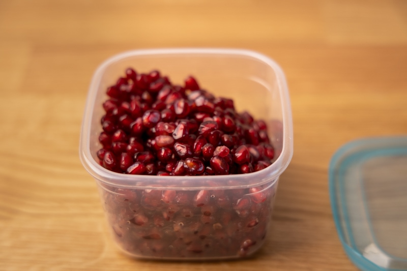 Pomegranate arils in a container