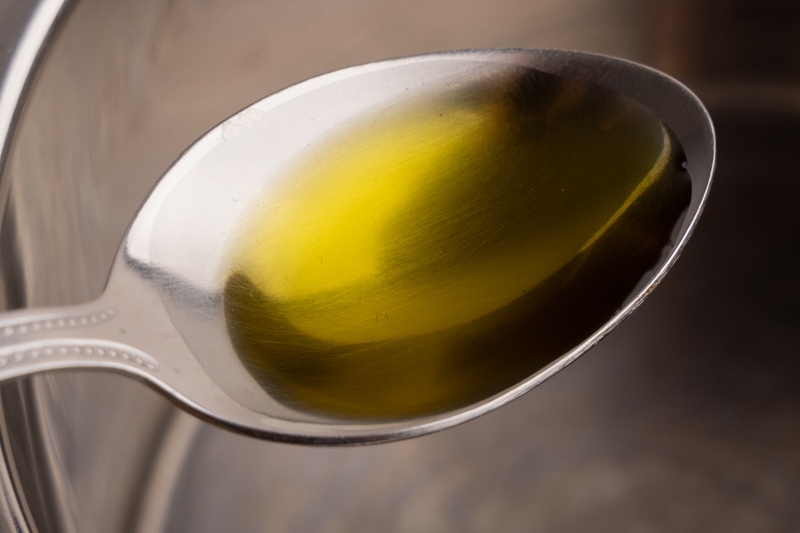 Pouring oil into a pot