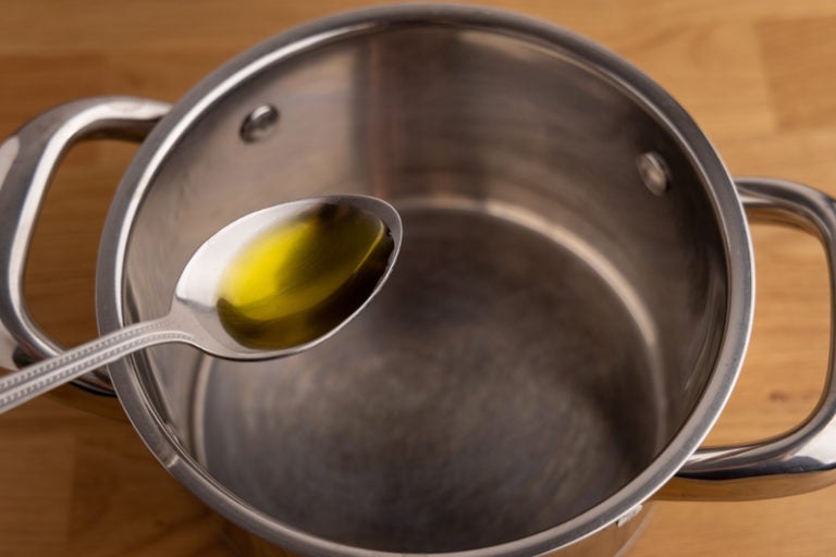 Pouring olive oil into a pot