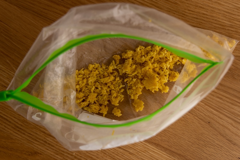 Pre-frozen lemon zest in a freezer bag